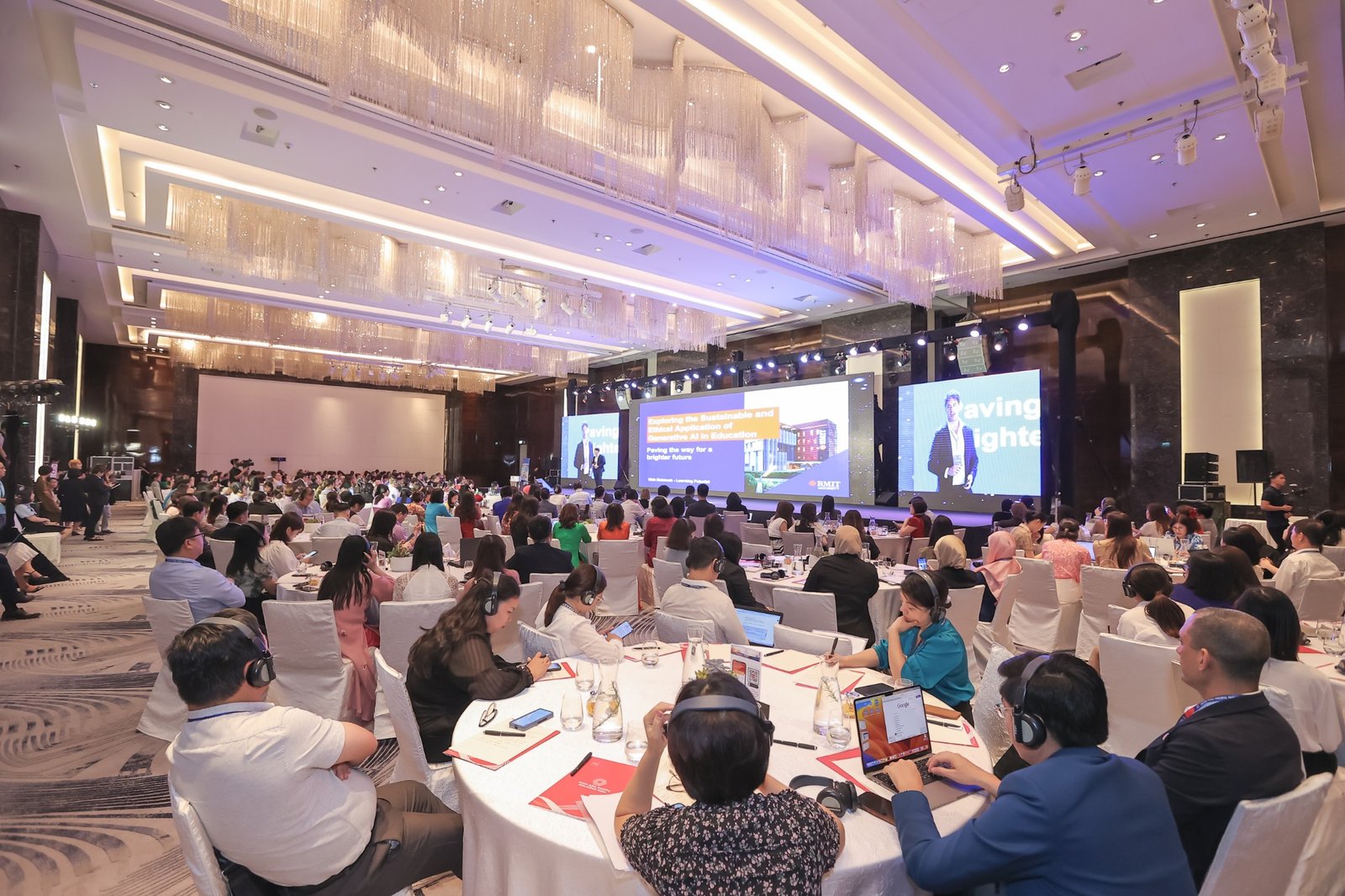 Nick McIntosh speaking on a large stage at the ACCA Asia Pacific Dialogue in Hanoi